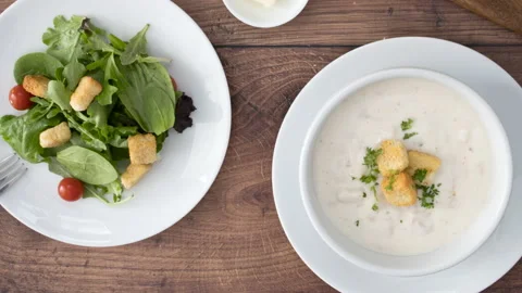 Panning Overhead a Bowl of Clam Chowder and Salad Stock Footage 149995976