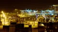 Panning overview night timelapse logistics port at night machinery cranes cargo HD Footage