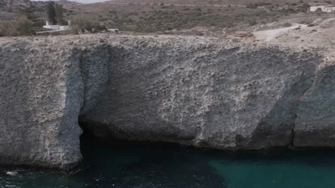 Panning of Papafragas caves and cliffs in the Greek island of Milos. Stock Footage 160892377