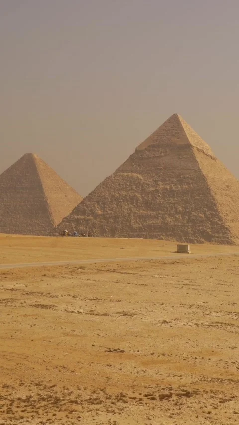 Panning plane of the beautiful pyramids of Giza. Cairo, Egypt Stock Footage 260472949