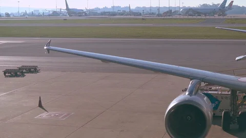 Panning plane wing, engine, turbine, cockpit, Lisbon airport. Stock Footage 110816920
