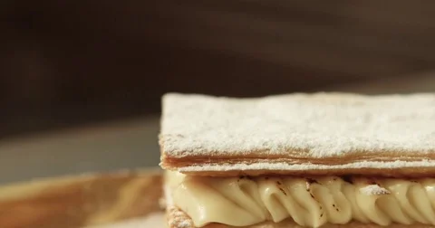 Panning of puff pastry cake covered by sugar powder Video stock 76281229