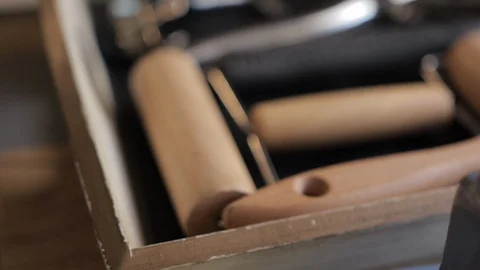 Panning pull focus over tray of tools used by craftsman. Stock Footage 98096184