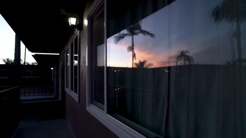 Panning Right Apartment Window Sunset Reflection Video stock 92402728