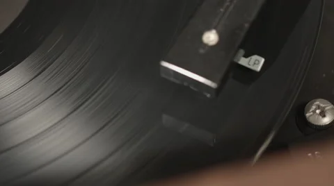 Panning Right on Closeup of Vinyl Record Spinning on Player Stock Footage 61709589