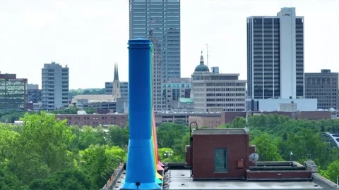Panning right shot with Science Central smokestacks and downtown Fort Wayne in Stock Footage 246977299