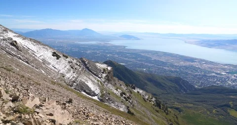 Panning right shot from the summit of Mount Timpanogos looking down on Utah Lake Stock Footage 120211383