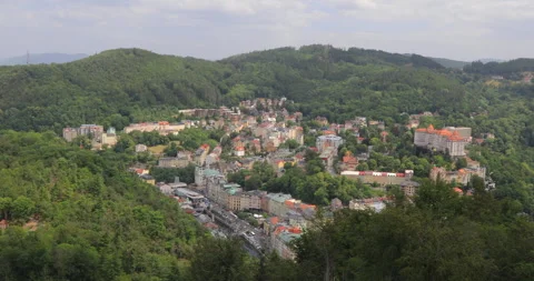 Panning right view of city centre and moiuntains at Karlovy Vary from lookout Stock Footage 337805913