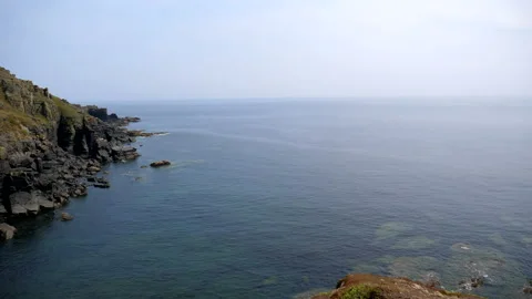 Panning from sea to colourful cliffs at Lizard Point 库存影片 141988313