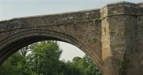 Panning shot across the north side of the Devils bridge at Kirkby Lonsdale Stock Footage 328654605