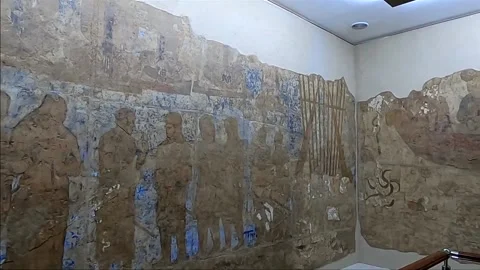 Panning shot of ancient 7th-century murals at Afrasiab Museum in Samarkand Stock Footage 336506589