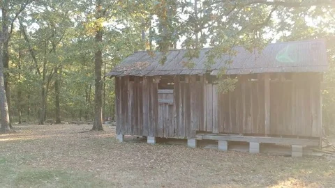 Panning shot of barn in mountains of Broken Bow, Oklahoma. Stock Footage 80509967