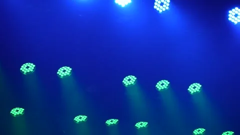 Panning shot of blue and green LED stage lights in smoke Stock Footage 346355447