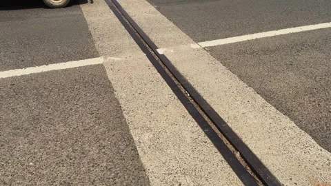 Panning Shot of Bridge Expansion Joint on Highway Deck Supporting Structural Stock Footage 341938010