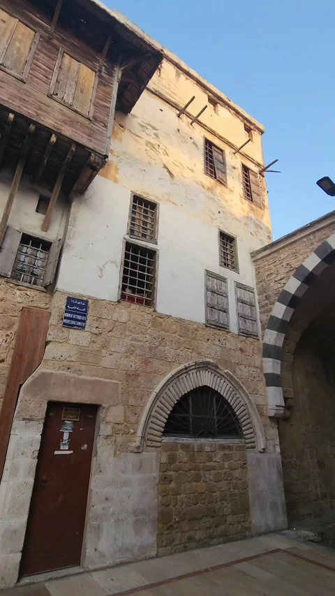 A panning shot of a building section of the mosque entrance complex Stock Footage 314314021