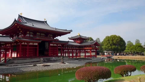 Panning Shot of Byodo-in Temple in Uji, Japan on a Winter Morning with Visitors Stock Footage 332772501