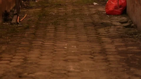 Panning shot of clothes drying on clothes line in messy ally in a hot country Stock Footage 107633494