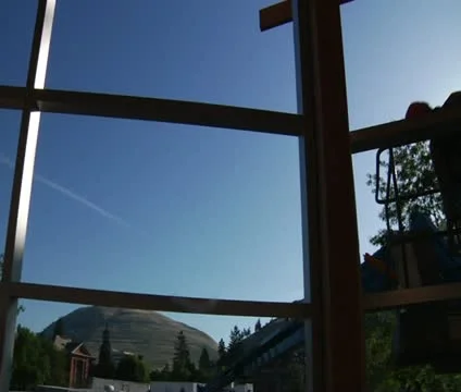 Panning shot to construction worker on Crane Stock Footage 21560609