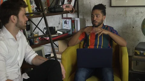 Panning shot of creative business workers discussing new business project Stock Footage 114855495