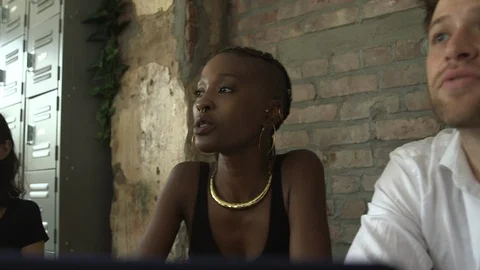 Panning shot of creative professionals agreeing to the new business work Stock Footage 114855850