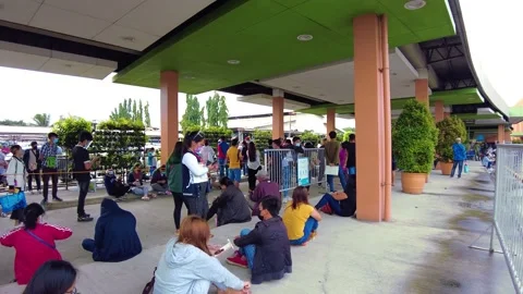 Panning shot of a crowded queue wearing a mask. Keeping social distancing Stock Footage 169019371