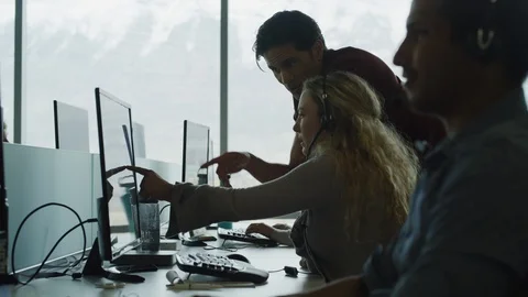 Panning shot of customer service representatives working together in call center Video stock 109572935