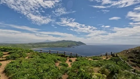 Panning shot elevated view of sea and island coast in summer  Stock Footage 244432657