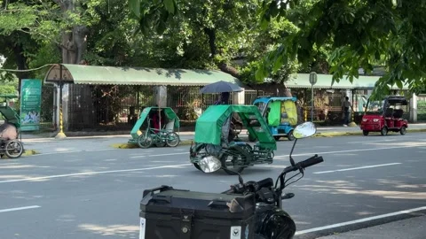 Panning shot of an empty local pedicab sikad moving in Intramuros 4K Vídeos de archivo 337458666