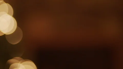 A panning shot with a focus pull of Christmas tree with lights infront of a Stock Footage 120288161