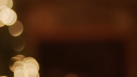 A panning shot with a focus pull of Christmas tree with lights infront of a Stock Footage 120291555