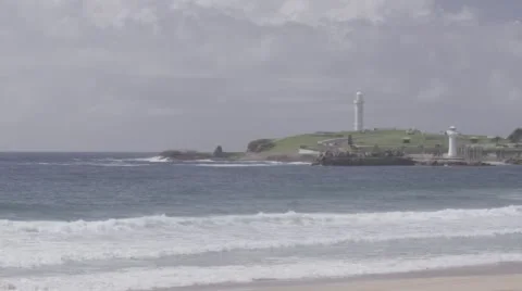 Panning shot of foreshore with lighthouses in background. Stock Footage 56510361