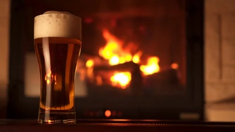 Panning shot full glass of appetizing cooled refreshment beer with foam 動画素材 103549252