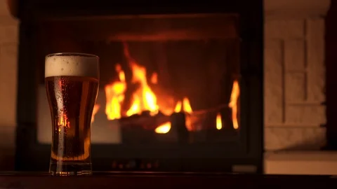Panning shot full glass of appetizing cooled refreshment beer with foam 動画素材 103549477