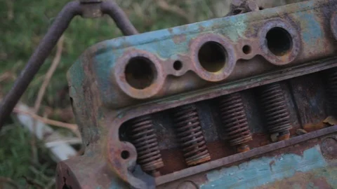 Panning shot of a green old rusty engine outside Stock Footage 101760541