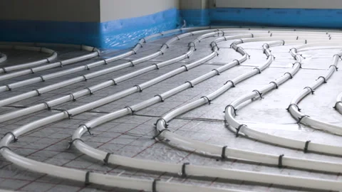 Panning shot of hydronic underfloor heating pipes inside a building Vídeos de archivo 235937571