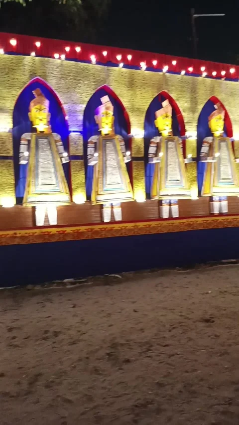 Panning Shot of Illuminated Durga Puja Pandal and Devotees Stock Footage 336722055