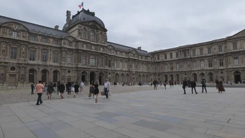 A panning shot of the inner yard of the Louvre museum. Stock Footage 278919913