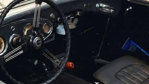 Panning shot of inside interior of retro car with steering wheel Stock Footage 113919320