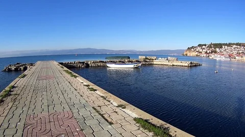 Panning shot of jetty and old town of Ohrid on sunny day, Macedonia Video stock 80894242