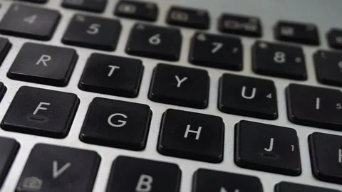 Panning shot of laptop keyboard from left to right Stock Footage 313099871