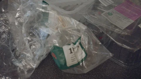 Panning shot of leftover plastic packaging waste Stock Footage 95187262