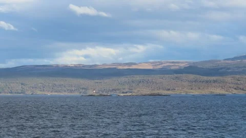 Panning shot of Les Eclaireurs Lighthouse on cruidse Stock Footage 275568613