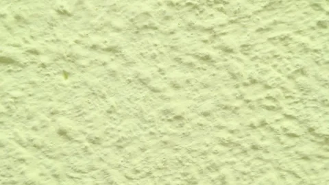 Panning Shot of Light Yellow Pale Textured Plaster Wall Surface Texture Stock Footage 336784925