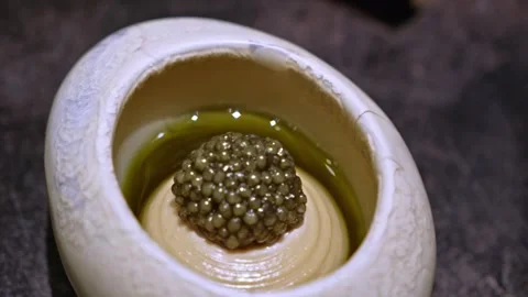Panning Shot of Macadamia, Caviar, and Kelp in Ceramic Bowl Video stock 314318382
