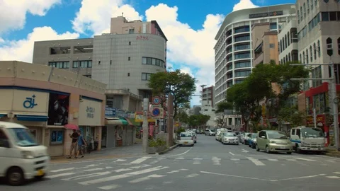 Panning shot at main intersection of Kokusai street Naha Okinawa Japan Stock Footage 123810681