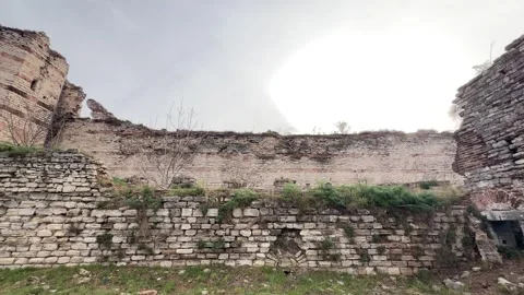Panning shot massive stone ruins and crumbling brick fortifications Stock Footage 340155054