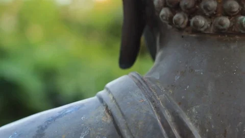 Panning shot moving past the back of the head of a Thai Buddha statue  Stock Footage 101635339