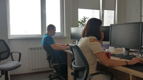 Panning shot of office workers doing job on pc Video stock 93712613