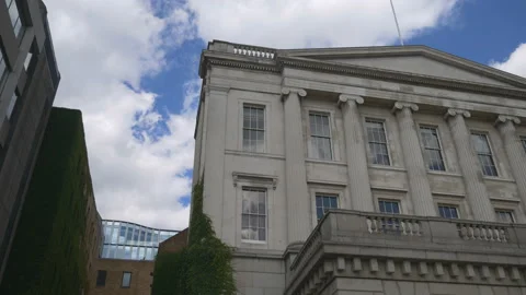 A panning shot of an old building covered in plants. Stock Footage 117183172
