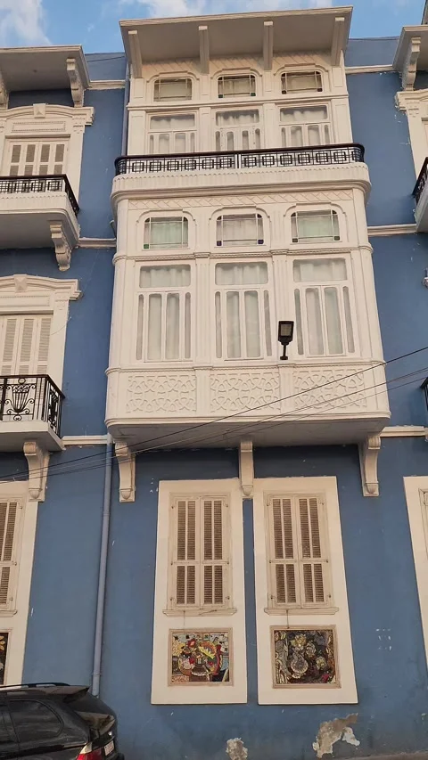 A panning shot of an old building's facade in Tripoli Lebanon Stock-Footage 314209060